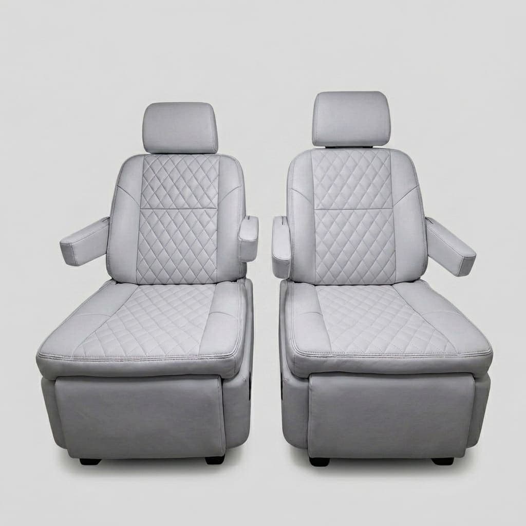 Premium light gray quilted leather captain's chairs reclined with footrests extended, showing electric reclining and footrest adjustment
