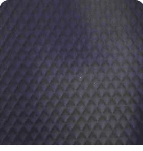 Close-up of rich charcoal dark gray quilted leather interior lining with diamond stitching